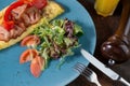 Omelet with vegetables fried bacon and orange juice Royalty Free Stock Photo