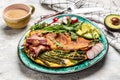 Omelette asparagus, fried egg, avocado, arugula, bacon ham and cheese. Ketogenic diet. Low carb high fat breakfast. Healthy food Royalty Free Stock Photo