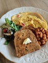 Omelette. Baked beans. Toast. Salad. Royalty Free Stock Photo