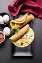 Omelette / omelette chapati roll or Indian bread or roti rolled with omlet. Royalty Free Stock Photo