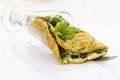 Omelette filled with spinach in glass
