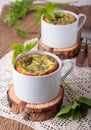 Omelette with goutweed in ceramic cups Royalty Free Stock Photo