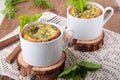 Omelette with goutweed in white ceramic cups