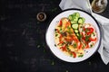 Omelette with mushrooms, paprika, tomatoes and sandwich with cream cheese on white plate. Royalty Free Stock Photo