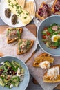 Omelette, salad bowl and belgian waffles breakfast table set up flat lay