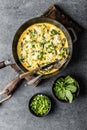 Omelette with spinach and cheese in a pan top view Royalty Free Stock Photo