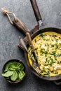 Omelette with spinach and cheese in a pan top view Royalty Free Stock Photo
