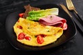 Omelette with tomatoes and cheese with bread and mortadella sausage Royalty Free Stock Photo