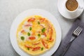 omelette with tomatoes and a cup of fresh coffee on the table. great breakfast Royalty Free Stock Photo