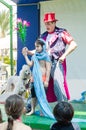 Omer (Beer-Sheva), ISRAEL - The boy, clown, two white poodle on a stage show magic tricks for children July 25, 2015