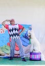 Omer, ISRAEL -Clown and circus poodle on a drum perform on the summer stage, July 25, 2015