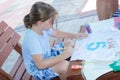 Omer, Negev, ISRAEL - August 15, Child writes number five colors and the letters of his name in Hebrew, 2015