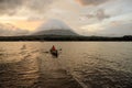 A fishermen boat is rowing in lake Nicaragua with volcano Royalty Free Stock Photo