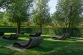 ÃÂ¡omfortable loungers for rest in shade of deciduous trees. Public landscape city park Krasnodar or `Galitsky park` for relaxation Royalty Free Stock Photo