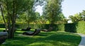 ÃÂ¡omfortable loungers for rest in shade of deciduous trees. Public landscape city park Krasnodar or `Galitsky park` for relaxation Royalty Free Stock Photo