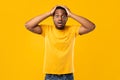 Black Man Touching Head In Shock Posing Over Yellow Background Royalty Free Stock Photo