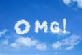 OMG cloud word with exclamation mark on bright blue cloudy sky background Royalty Free Stock Photo
