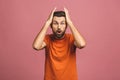 OMG! It`s incredible! Portrait of handsome young man in glasses looking at camera while standing against pink background. Close u Royalty Free Stock Photo