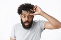 Omg unbelievable. Portrait of impressed and surprised handsome adult african american bearded guy taking off glasses Royalty Free Stock Photo