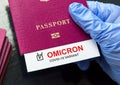 Omicron COVID-19 variant and travel concept, test positive result note in passport