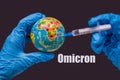 Omicron variant of COVID. New strain of coronavirus. Does the vaccine work. Syringe vaccinates the globe, on a map of Royalty Free Stock Photo