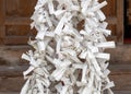 Omikuji, strips of paper with fortunes or prayers written on them, at Anamizuomiya shinto shrine, Japan Royalty Free Stock Photo