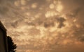 Mammatus clouds with house and tree Royalty Free Stock Photo