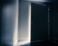 Ominous door slightly open with shaft of light Royalty Free Stock Photo