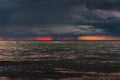 Ominous fiery dawn on the sea