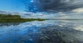 Ominous stormy sky reflection over natural lake Royalty Free Stock Photo