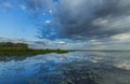 Ominous stormy sky reflection over natural lake Royalty Free Stock Photo
