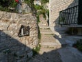 Omis, Croatia - July 23, 2021: Narrow street in the old town of Omis leading to the Mirabela fortress. Croatian historic street