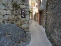 Omis, Croatia - July 23, 2021: Narrow street in the old town of Omis leading to the Mirabela fortress. Croatian historic street