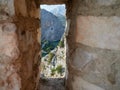 Omis, Croatia - July 23, 2021: Narrow view of the Cetina estuary and the canyon through the window of the Mirabela fortress.