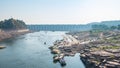 Omkareshwar cityscape, India, sacred hindu temple. Holy Narmada River, boats floating. Travel destination for tourists and pilgrim