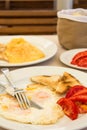 Omlette with toast bread and tomatoes