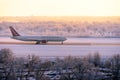 Omni Air Internation airlines plane just landing at Lviv International airport at sunset. Lviv, Ukraine - December 03, 2021