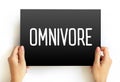 Omnivore is an organism that eats plants and animals, text concept on card