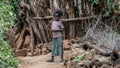 Unidentified Ethiopian girl walking in her village