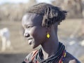 OMO RIVER, ETHIOPIA, MAY 11TH. 2019, Portrait of girl of Dassanech tribe, May 11Th. 2018 dating in Omo river, Ethiopia