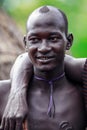 Portrait of Happy and Satisfied African Man with Traditional dress in the local Mursi tribe village