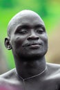 Portrait of Happy and Satisfied African Man with Traditional dress in the local Mursi tribe village