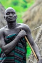 Portrait of Happy and Satisfied African Man with Traditional dress in the local Mursi tribe village