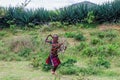 Tired Hamer Tribe Women coming back from Farm Work by the Green Rural Road