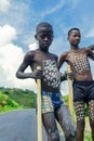 Young Boys of Benna Tribe with Traditional Body Painting on the Long Wooden Sticks posing for the picture Royalty Free Stock Photo