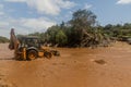 OMO VALLEY, ETHIOPIA - FEBRUARY 4, 2020: Bulldozer leveling a ford crossing of Kizo river, Ethiop