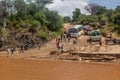 OMO VALLEY, ETHIOPIA - FEBRUARY 4, 2020: People waiting at the ford of Kizo river, Ethiop