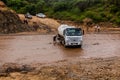 OMO VALLEY, ETHIOPIA - FEBRUARY 4, 2020: Truck stuck in swollen waters of Kizo river, Ethiop