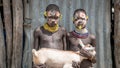 Portrait of unidentified Karo tribe children holding a goat, Colcho, Omo Valley, Ethiopia.