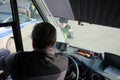 A police officer checks the documents with the bus driver